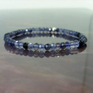 Shop Iolite Bracelets! Dainty Iolite Cordierite faceted Bracelet 4mm + Sterling Silver Bead, Natural Gemstone Bracelet, Stretch Beaded Bracelet for Women +Gift Bag | Natural genuine Iolite bracelets. Buy crystal jewelry, handmade handcrafted artisan jewelry for women.  Unique handmade gift ideas. #jewelry #beadedbracelets #beadedjewelry #gift #shopping #handmadejewelry #fashion #style #product #bracelets #affiliate #ad