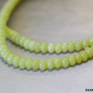 Shop Jade Beads! S/ Olive Jade 6mm Rondelle beads 16" strand Natural nephrite jade gemstone beads for jewelry making | Natural genuine beads Jade beads for beading and jewelry making.  #jewelry #beads #beadedjewelry #diyjewelry #jewelrymaking #beadstore #beading #affiliate #ad