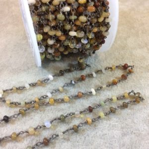 Shop Opal Rondelle Beads! Gunmetal Plated Copper Rosary Chain W 3-4mm Smooth Mixed Ethiopian Opal Rondelle Beads (CH187-GM) – Sold by the Foot! – Natural Beaded Chain | Natural genuine rondelle Opal beads for beading and jewelry making.  #jewelry #beads #beadedjewelry #diyjewelry #jewelrymaking #beadstore #beading #affiliate #ad