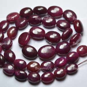 Shop Ruby Bead Shapes! 16 Inch strand,Natural Dyed Ruby Smooth Oval Beads.Size 10-14mm | Natural genuine other-shape Ruby beads for beading and jewelry making.  #jewelry #beads #beadedjewelry #diyjewelry #jewelrymaking #beadstore #beading #affiliate #ad