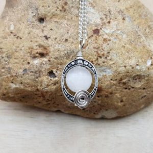 Small Selenite Pendant. Crystal Reiki jewelry uk. Silver plated oval frame necklace. Wire wrap pendant. Empowered crystals | Natural genuine Gemstone jewelry. Buy crystal jewelry, handmade handcrafted artisan jewelry for women.  Unique handmade gift ideas. #jewelry #beadedjewelry #beadedjewelry #gift #shopping #handmadejewelry #fashion #style #product #jewelry #affiliate #ad