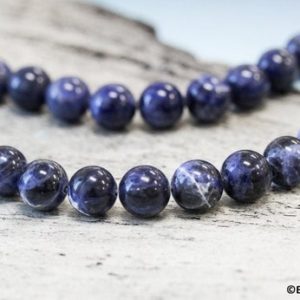 Shop Sodalite Round Beads! M/ Sodalite 10mm/ 12mm Smooth Round Loose Beads. 15.5" strand. Natural dark blue gemstone beads for jewelry making | Natural genuine round Sodalite beads for beading and jewelry making.  #jewelry #beads #beadedjewelry #diyjewelry #jewelrymaking #beadstore #beading #affiliate #ad