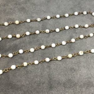 Shop Turquoise Faceted Beads! Brass Plated Copper Rosary Chain with 3mm Faceted Round Shaped White Buffalo Turquoise Beads – Sold by the Foot! – Natural Beaded Chain | Natural genuine faceted Turquoise beads for beading and jewelry making.  #jewelry #beads #beadedjewelry #diyjewelry #jewelrymaking #beadstore #beading #affiliate #ad
