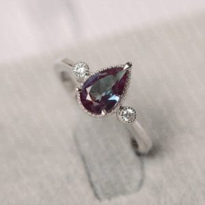 Shop Alexandrite Jewelry! Alexandrite ring pear cut June birthstone ring white gold wedding ring for women | Natural genuine Alexandrite jewelry. Buy handcrafted artisan wedding jewelry.  Unique handmade bridal jewelry gift ideas. #jewelry #beadedjewelry #gift #crystaljewelry #shopping #handmadejewelry #wedding #bridal #jewelry #affiliate #ad