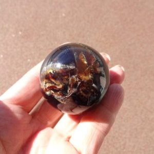 Shop Amber Shapes! Indonesian mbr sphere 45mm organic gems natural stone sphere | Natural genuine stones & crystals in various shapes & sizes. Buy raw cut, tumbled, or polished gemstones for making jewelry or crystal healing energy vibration raising reiki stones. #crystals #gemstones #crystalhealing #crystalsandgemstones #energyhealing #affiliate #ad