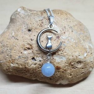Shop Angelite Pendants! Crescent moon cat necklace Angelite pendant. Blue Reiki jewelry uk. Spirit animal. Boho hippie necklaces for women | Natural genuine Angelite pendants. Buy crystal jewelry, handmade handcrafted artisan jewelry for women.  Unique handmade gift ideas. #jewelry #beadedpendants #beadedjewelry #gift #shopping #handmadejewelry #fashion #style #product #pendants #affiliate #ad