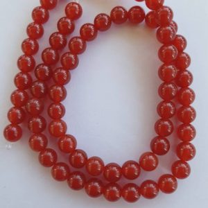 Shop Carnelian Round Beads! Carnelian 6mm round beads. Red orange colour. Approx 66 beads. 16 inch/40cm strand. | Natural genuine round Carnelian beads for beading and jewelry making.  #jewelry #beads #beadedjewelry #diyjewelry #jewelrymaking #beadstore #beading #affiliate #ad