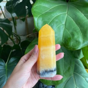 Shop Orange Calcite Points & Wands! Orange calcite tower | Natural genuine stones & crystals in various shapes & sizes. Buy raw cut, tumbled, or polished gemstones for making jewelry or crystal healing energy vibration raising reiki stones. #crystals #gemstones #crystalhealing #crystalsandgemstones #energyhealing #affiliate #ad