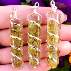 Peridot Crystal Healing Cut spiral wrapped Gemstone resin Point Pendant with Metal Bail | Natural genuine Gemstone pendants. Buy crystal jewelry, handmade handcrafted artisan jewelry for women.  Unique handmade gift ideas. #jewelry #beadedpendants #beadedjewelry #gift #shopping #handmadejewelry #fashion #style #product #pendants #affiliate #ad