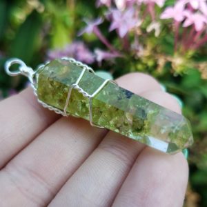 Shop Peridot Jewelry! Peridot Crystal Healing Cut wire wrapped Gemstone resin Point Pendant with Metal Bail | Natural genuine Peridot jewelry. Buy crystal jewelry, handmade handcrafted artisan jewelry for women.  Unique handmade gift ideas. #jewelry #beadedjewelry #beadedjewelry #gift #shopping #handmadejewelry #fashion #style #product #jewelry #affiliate #ad