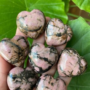 Shop Rhodonite Shapes! Rhodonite heart, protection stone, healing stone, love stone | Natural genuine stones & crystals in various shapes & sizes. Buy raw cut, tumbled, or polished gemstones for making jewelry or crystal healing energy vibration raising reiki stones. #crystals #gemstones #crystalhealing #crystalsandgemstones #energyhealing #affiliate #ad
