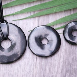 Genuine Shungite EMF Protection 50mm, 40mm, 30mm Donut Pi Stone Pendants Optional 2mm Waxed Cotton Cord 5G Karelia, Russia | Natural genuine Shungite pendants. Buy crystal jewelry, handmade handcrafted artisan jewelry for women.  Unique handmade gift ideas. #jewelry #beadedpendants #beadedjewelry #gift #shopping #handmadejewelry #fashion #style #product #pendants #affiliate #ad