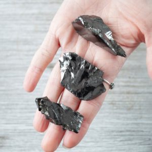 Shop Shungite Stones & Crystals! Elite Shungite, Karelian, Highest Purity Raw Shungite Stone | Natural genuine stones & crystals in various shapes & sizes. Buy raw cut, tumbled, or polished gemstones for making jewelry or crystal healing energy vibration raising reiki stones. #crystals #gemstones #crystalhealing #crystalsandgemstones #energyhealing #affiliate #ad