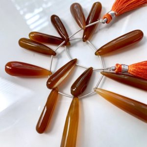 Shop Amber Bead Shapes! 1/2 strand of orange chalcedony long drops | Natural genuine other-shape Amber beads for beading and jewelry making.  #jewelry #beads #beadedjewelry #diyjewelry #jewelrymaking #beadstore #beading #affiliate #ad