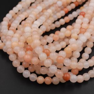 Shop Aventurine Beads! Natural Peach Aventurine Smooth Round Beads 4mm 6mm 8mm 10mm Icy Soft Pastel Pink Peach Gemstone AAA Grade 15.5" Strand | Natural genuine beads Aventurine beads for beading and jewelry making.  #jewelry #beads #beadedjewelry #diyjewelry #jewelrymaking #beadstore #beading #affiliate #ad