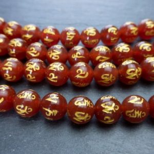 Shop Carnelian Beads! red OM gemstone beads – Red carnelian prayer beads – 108 beads meditation beads – gold stamped healing gemstone beads – 15 inch | Natural genuine beads Carnelian beads for beading and jewelry making.  #jewelry #beads #beadedjewelry #diyjewelry #jewelrymaking #beadstore #beading #affiliate #ad