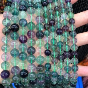 Shop Fluorite Beads! A+ Green Purple Fluorite Stone Beads, Natural Gemstone Beads, Round Beads 4mm 6mm 8mm 10mm 12mm 15'' | Natural genuine beads Fluorite beads for beading and jewelry making.  #jewelry #beads #beadedjewelry #diyjewelry #jewelrymaking #beadstore #beading #affiliate #ad