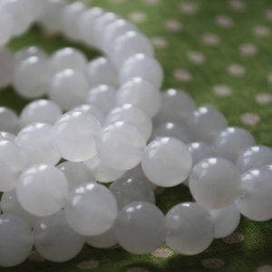 Shop Jade Beads! High Quality Grade A Natural White Snow Jade Semi-precious Gemstone Round Beads – 4mm, 6mm, 8mm, 10mm sizes – 15" strand | Natural genuine beads Jade beads for beading and jewelry making.  #jewelry #beads #beadedjewelry #diyjewelry #jewelrymaking #beadstore #beading #affiliate #ad