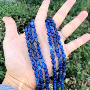 Shop Kyanite Chip & Nugget Beads! 1 Strand/15" Natural Blue Kyanite Healing Gemstone 6mm to 8mm Free Form Oval Tumbled Pebble Stone Beads for Necklace Bracelet Jewelry Making | Natural genuine chip Kyanite beads for beading and jewelry making.  #jewelry #beads #beadedjewelry #diyjewelry #jewelrymaking #beadstore #beading #affiliate #ad