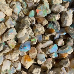 Shop Raw & Rough Opal Stones! Bulk Rough Ethiopian Welo Opal with Bright Rainbow Fire Opal, Raw Lots, Bulk, Wholesale | Natural genuine stones & crystals in various shapes & sizes. Buy raw cut, tumbled, or polished gemstones for making jewelry or crystal healing energy vibration raising reiki stones. #crystals #gemstones #crystalhealing #crystalsandgemstones #energyhealing #affiliate #ad
