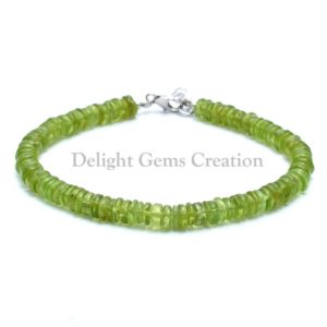 Shop Peridot Bracelets! AAA++ Natural Peridot Beaded Bracelet, Smooth Tyre 5.5-6mm Peridot Bracelet, Peridot Disc Bracelet, Green Peridot Gemstone Beads Bracelet | Natural genuine Peridot bracelets. Buy crystal jewelry, handmade handcrafted artisan jewelry for women.  Unique handmade gift ideas. #jewelry #beadedbracelets #beadedjewelry #gift #shopping #handmadejewelry #fashion #style #product #bracelets #affiliate #ad