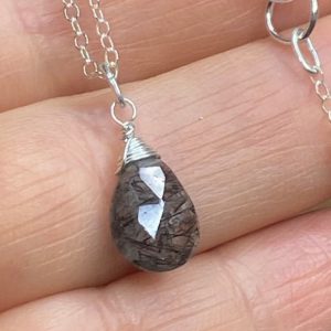 Rutilated Quartz Necklace. Black rutile pendant.  Clear Rutilated Quartz drop. Sterling Silver necklace.  Modern jewelry. Wire wrapped. | Natural genuine Rutilated Quartz pendants. Buy crystal jewelry, handmade handcrafted artisan jewelry for women.  Unique handmade gift ideas. #jewelry #beadedpendants #beadedjewelry #gift #shopping #handmadejewelry #fashion #style #product #pendants #affiliate #ad