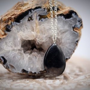 Shop Shungite Jewelry! Shungite Smooth Pear Shaped Pendant Necklace Choice of Sterling Silver or Black Cotton Cord | Natural genuine Shungite jewelry. Buy crystal jewelry, handmade handcrafted artisan jewelry for women.  Unique handmade gift ideas. #jewelry #beadedjewelry #beadedjewelry #gift #shopping #handmadejewelry #fashion #style #product #jewelry #affiliate #ad
