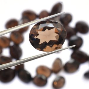 Shop Smoky Quartz Faceted Beads! Natural Smoky Quartz 13x18mm Oval Cut Loose Gemstone | Semi Precious Brown Smoky Quartz Cut Faceted Oval Loose Gemstone for Jewelry Making | Natural genuine faceted Smoky Quartz beads for beading and jewelry making.  #jewelry #beads #beadedjewelry #diyjewelry #jewelrymaking #beadstore #beading #affiliate #ad
