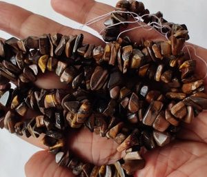 Shop Tiger Eye Chip & Nugget Beads! 35"  Tiger Eye Chip Beads, Uncut Chip Bead, 3-7mm, Polished Beads, Smooth Tiger Eye Chip Bead, Wholesale Price, Jewelery Supplies | Natural genuine chip Tiger Eye beads for beading and jewelry making.  #jewelry #beads #beadedjewelry #diyjewelry #jewelrymaking #beadstore #beading #affiliate #ad