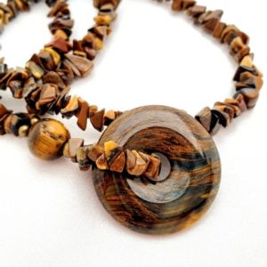 Shop Tiger Eye Pendants! Tiger eye protective circle talisman pendant necklace. Shimmering golden brown gemstones. Long bold statement jewelry | Natural genuine Tiger Eye pendants. Buy crystal jewelry, handmade handcrafted artisan jewelry for women.  Unique handmade gift ideas. #jewelry #beadedpendants #beadedjewelry #gift #shopping #handmadejewelry #fashion #style #product #pendants #affiliate #ad