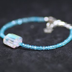 Shop Topaz Bracelets! Natural Swiss Blue Topaz and Rainbow Quartz Bracelet Sterling Silver Lotus Charm , December Birthstone , 4th  Anniversary , layering | Natural genuine Topaz bracelets. Buy crystal jewelry, handmade handcrafted artisan jewelry for women.  Unique handmade gift ideas. #jewelry #beadedbracelets #beadedjewelry #gift #shopping #handmadejewelry #fashion #style #product #bracelets #affiliate #ad