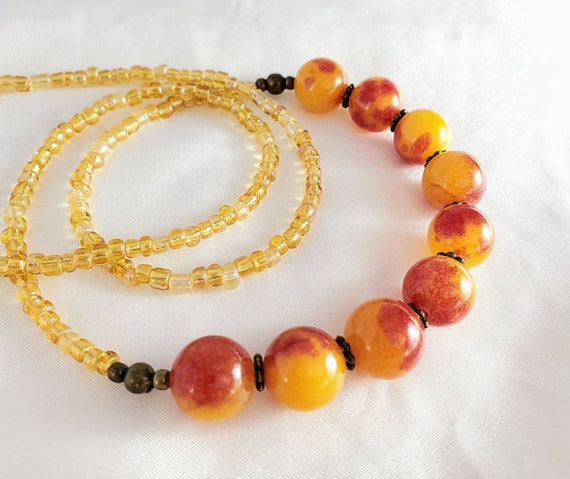 Simple, Long Layering Necklace With Agate Spheres. Yellow, Orange & Red Swirled Gemstones, Beige, Gold And Bronze Accents.