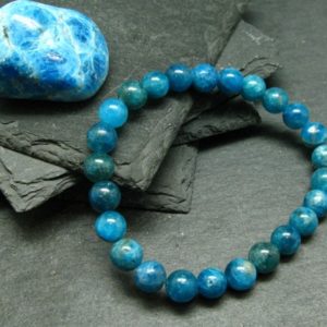 Shop Apatite Bracelets! Neon Blue Apatite Genuine Bracelet ~ 7 Inches  ~ 8mm Round Beads | Natural genuine Apatite bracelets. Buy crystal jewelry, handmade handcrafted artisan jewelry for women.  Unique handmade gift ideas. #jewelry #beadedbracelets #beadedjewelry #gift #shopping #handmadejewelry #fashion #style #product #bracelets #affiliate #ad