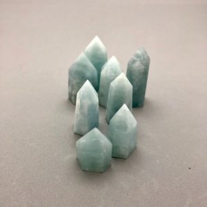 Shop Aquamarine Points & Wands! One Mini Aquamarine Point (Available in 2 Sizes) for Throat Chakra Healing, Water Magic, Calming Anxiety, Self Expression, Crystal Grids | Natural genuine stones & crystals in various shapes & sizes. Buy raw cut, tumbled, or polished gemstones for making jewelry or crystal healing energy vibration raising reiki stones. #crystals #gemstones #crystalhealing #crystalsandgemstones #energyhealing #affiliate #ad