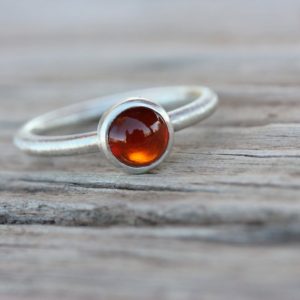 Shop Garnet Rings! Simple Modern Rust Red Cinnamon Garnet Silver Ring Stackable January Birthstone Hessonite Grossular Round Circular Cabochon – Auburn Aureole | Natural genuine Garnet rings, simple unique handcrafted gemstone rings. #rings #jewelry #shopping #gift #handmade #fashion #style #affiliate #ad