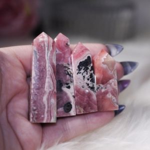 Shop Rhodochrosite Stones & Crystals! High Grade Rhodochrosite Points | Natural genuine stones & crystals in various shapes & sizes. Buy raw cut, tumbled, or polished gemstones for making jewelry or crystal healing energy vibration raising reiki stones. #crystals #gemstones #crystalhealing #crystalsandgemstones #energyhealing #affiliate #ad