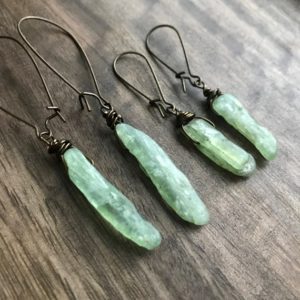 Shop Kyanite Jewelry! Raw Stone Earrings, Green Kyanite Earrings , Boho Dangle Earrings ,Kyanite Crystal Earrings, Raw Crystal Earrings, Boho Stone Earrings | Natural genuine Kyanite jewelry. Buy crystal jewelry, handmade handcrafted artisan jewelry for women.  Unique handmade gift ideas. #jewelry #beadedjewelry #beadedjewelry #gift #shopping #handmadejewelry #fashion #style #product #jewelry #affiliate #ad
