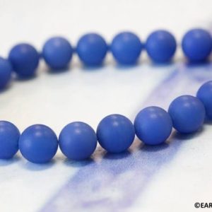 Shop Onyx Round Beads! M/ Matte Blue Onyx 12mm/ 10mm Smooth Round loose beads Matte Finished Dyed blue 16" strand | Natural genuine round Onyx beads for beading and jewelry making.  #jewelry #beads #beadedjewelry #diyjewelry #jewelrymaking #beadstore #beading #affiliate #ad
