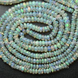 Shop Opal Rondelle Beads! 14 Inches strand,Finest Quality,Natural Ethiopian Opal Smooth Rondelles.3-4.5mm | Natural genuine rondelle Opal beads for beading and jewelry making.  #jewelry #beads #beadedjewelry #diyjewelry #jewelrymaking #beadstore #beading #affiliate #ad