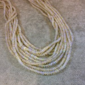 Shop Opal Rondelle Beads! 2-4mm Smooth Pale Rainbow Ethiopian Opal Graduated Rondelle Shaped Beads – 17" Strand (Approx. 250 Beads) – High Quality Indian Gemstone | Natural genuine rondelle Opal beads for beading and jewelry making.  #jewelry #beads #beadedjewelry #diyjewelry #jewelrymaking #beadstore #beading #affiliate #ad