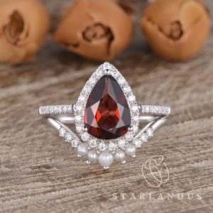 Pear Shaped Garnet Engagement Ring White Gold Bridal Set Pear Garnet January Birthstone Antique Curved Pearl Wedding Band Women Stacking | Natural genuine Gemstone rings, simple unique alternative gemstone engagement rings. #rings #jewelry #bridal #wedding #jewelryaccessories #engagementrings #weddingideas #affiliate #ad