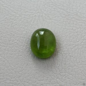 Shop Peridot Stones & Crystals! 7.13ct Loose Peridot Gemstone from Pakistan – Oval Cabochon Cut | Natural genuine stones & crystals in various shapes & sizes. Buy raw cut, tumbled, or polished gemstones for making jewelry or crystal healing energy vibration raising reiki stones. #crystals #gemstones #crystalhealing #crystalsandgemstones #energyhealing #affiliate #ad
