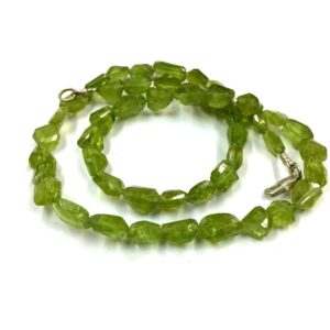 Shop Peridot Chip & Nugget Beads! Natural Faceted Green Peridot Nugget Shape Beads 7mm Gemstone Beads 18" Strand Wholesale Price | Natural genuine chip Peridot beads for beading and jewelry making.  #jewelry #beads #beadedjewelry #diyjewelry #jewelrymaking #beadstore #beading #affiliate #ad