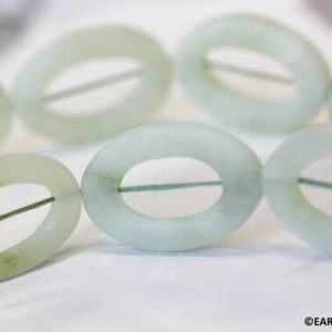 XL/ New Jade 25x35mm Oval Donut beads 16" strand Matte Finished Size/Shade varies Natural light green serpentine beads for jewelry making | Natural genuine beads Gemstone beads for beading and jewelry making.  #jewelry #beads #beadedjewelry #diyjewelry #jewelrymaking #beadstore #beading #affiliate #ad