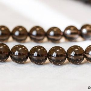 Shop Smoky Quartz Round Beads! L/Smoky Quartz 12mm Smooth Round Bead, 16' strand, Transparent Brown Quartz , Good Quality Beads For Jewelry Making | Natural genuine round Smoky Quartz beads for beading and jewelry making.  #jewelry #beads #beadedjewelry #diyjewelry #jewelrymaking #beadstore #beading #affiliate #ad