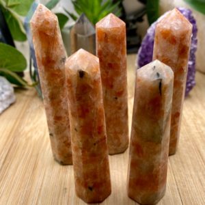 Shop Sunstone Points & Wands! Sunstone tower point obelisk | Natural genuine stones & crystals in various shapes & sizes. Buy raw cut, tumbled, or polished gemstones for making jewelry or crystal healing energy vibration raising reiki stones. #crystals #gemstones #crystalhealing #crystalsandgemstones #energyhealing #affiliate #ad