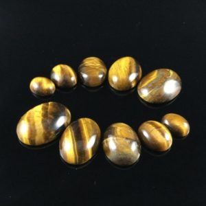Shop Tiger Eye Cabochons! 10pcs Tiger Eye Cabochons Oval Gemstone Cabochons Dome Cabochons Brown Tiger Stone Cabs 8×10 10×12 12×16 13×18 15×20 GC | Natural genuine stones & crystals in various shapes & sizes. Buy raw cut, tumbled, or polished gemstones for making jewelry or crystal healing energy vibration raising reiki stones. #crystals #gemstones #crystalhealing #crystalsandgemstones #energyhealing #affiliate #ad