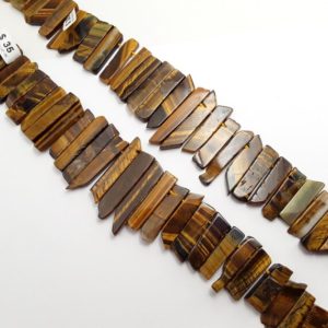 Shop Tiger Eye Beads! Yellow Tiger Eye Graduated Slice Stick Points Beads Approx 26-55mm 15.5" Strand | Natural genuine beads Tiger Eye beads for beading and jewelry making.  #jewelry #beads #beadedjewelry #diyjewelry #jewelrymaking #beadstore #beading #affiliate #ad