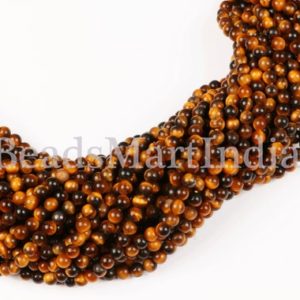 Shop Tiger Eye Round Beads! Tiger Eye Beads, Tiger Eye Smooth Beads, Tiger Eye Round Beads, Tiger Eye Smooth Round Beads, Tiger Eye Plain Beads, Tiger Eye Plain Round | Natural genuine round Tiger Eye beads for beading and jewelry making.  #jewelry #beads #beadedjewelry #diyjewelry #jewelrymaking #beadstore #beading #affiliate #ad