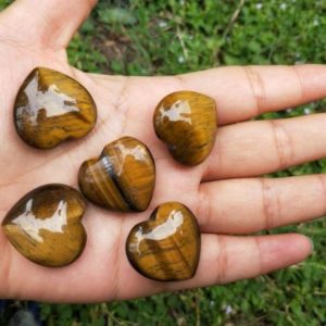 Shop Tiger Eye Stones & Crystals! Tiger's Eye Puffy Heart Healing Crystals and Stones | Natural genuine stones & crystals in various shapes & sizes. Buy raw cut, tumbled, or polished gemstones for making jewelry or crystal healing energy vibration raising reiki stones. #crystals #gemstones #crystalhealing #crystalsandgemstones #energyhealing #affiliate #ad